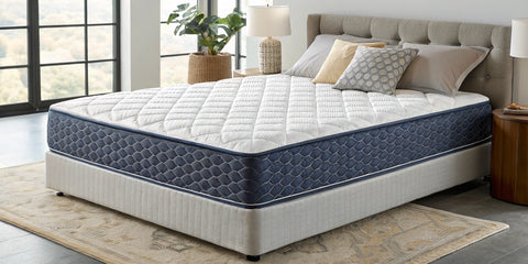 A firm hybrid mattress with supportive coils and a quilted top.