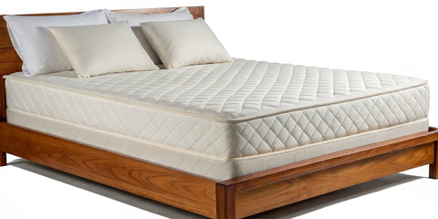 A latex mattress on a bed, showing the details to look for when you buy a new mattress.