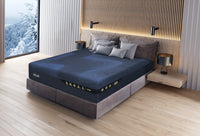 Modern bedroom with a bed featuring a blue mattress and gray frame, next to a window with a snowy landscape view.