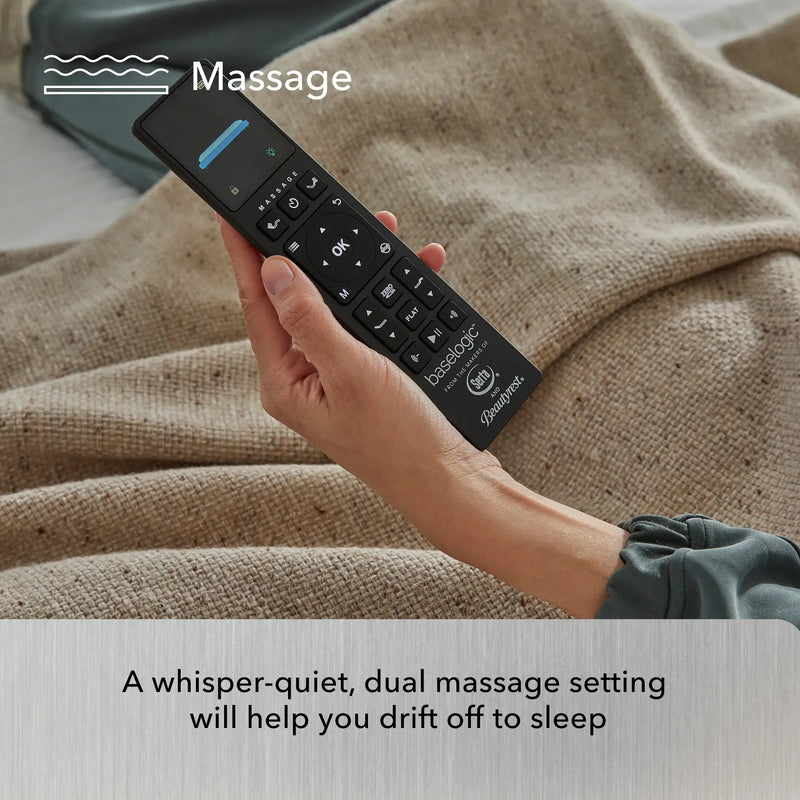 Hand holding a massage remote control with text about a whisper-quiet, dual massage setting.
