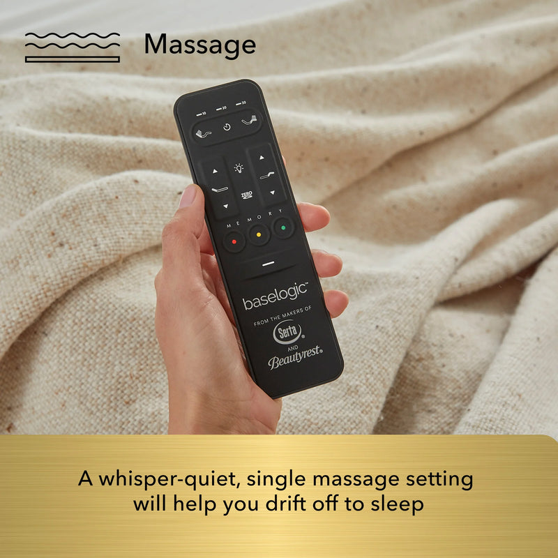 Hand holding a black remote control with 'baselogic' branding against a beige fabric background.