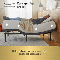 Man lying on a adjustable bed with zero-gravity preset feature in a bedroom setting.