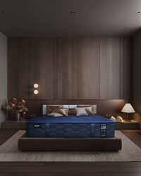 Blue mattress on a bed in a modern bedroom with wooden walls and decor.