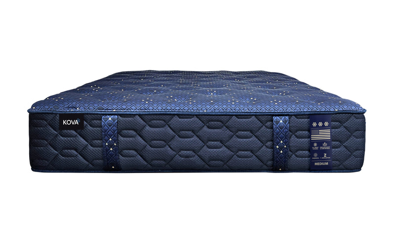 Blue mattress with quilted surface and branding on a white background