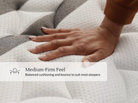Hand pressing into the medium-firm quilted surface of the Leesa Legend Chill Hybrid mattress