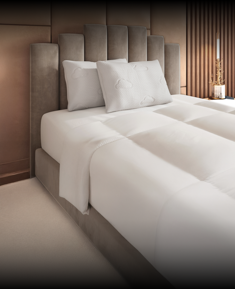 Puffy Signature Pillow on white bedding